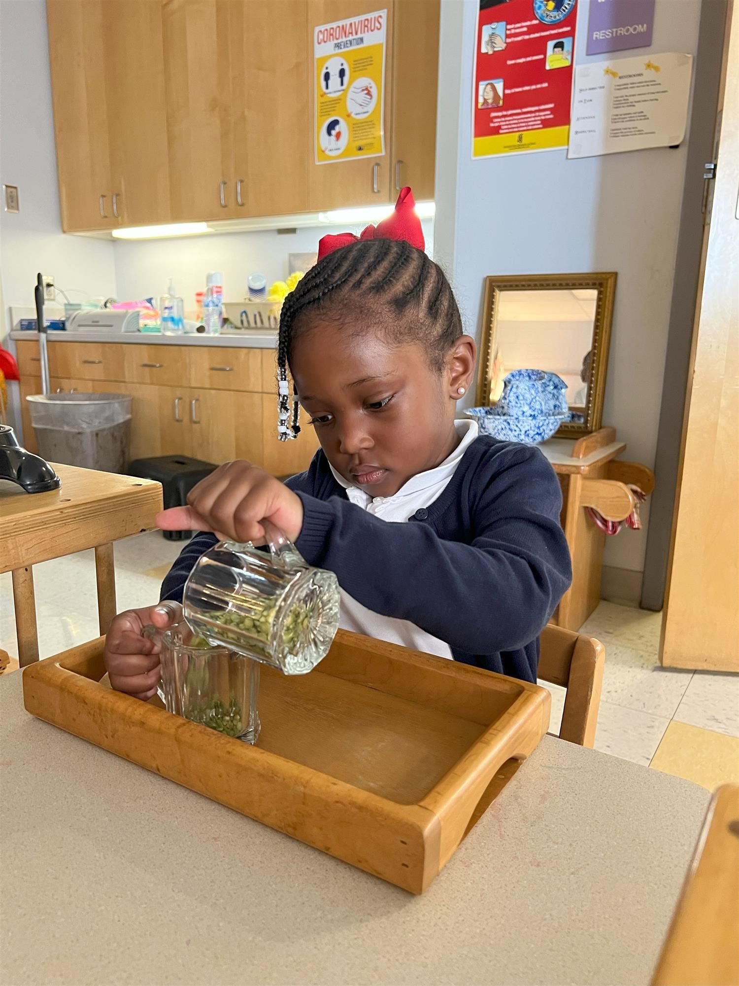 Young girl working on a fine motor skills activity Young girl working on a fine motor skills activity